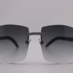 Handcrafted white buffalo horn sunglasses featuring endless iced nose bridge with sparkling stones, genuine white ox horn temples, and 58mm grey tint UV400 protection lenses - custom functional face art made in Michigan