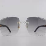 Handcrafted buffalo horn sunglasses featuring 2.2 carat VVS1 moissanite stones in low-profile prong setting on nose bridge, black genuine horn temples, and 58mm grey tint diamond cut lenses - one-of-a-kind functional face art made in Michigan