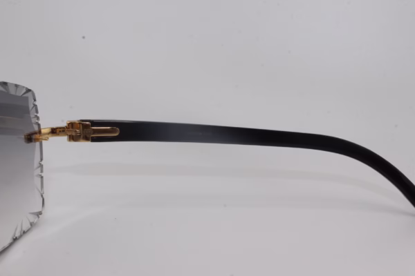 Handcrafted buffalo horn sunglasses featuring 2.2 carat VVS1 moissanite stones in low-profile prong setting on nose bridge, black genuine horn temples, and 58mm grey tint diamond cut lenses - one-of-a-kind functional face art made in Michigan